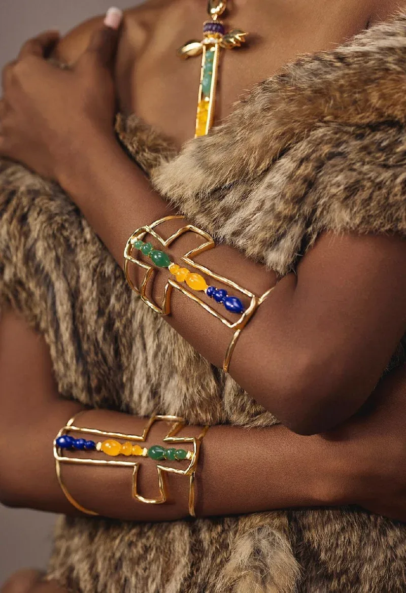 An open cuff and a charm bracelet
